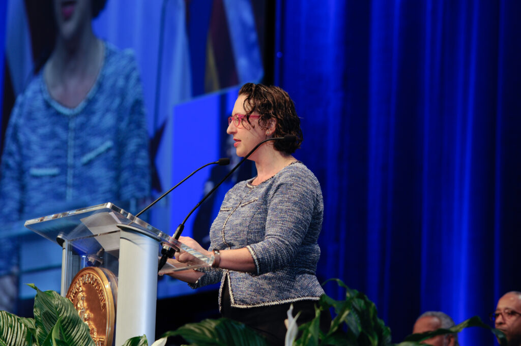 Councilmember Nadeau speaking at lectern