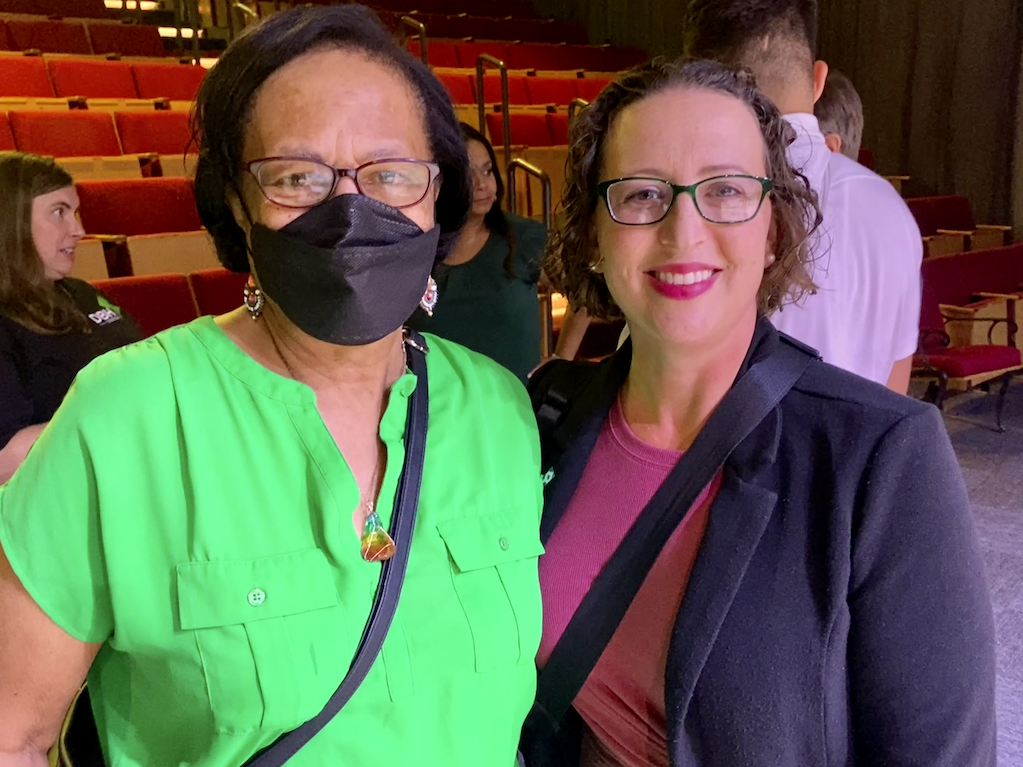 Councilmember Nadeau with resident in the auditorium