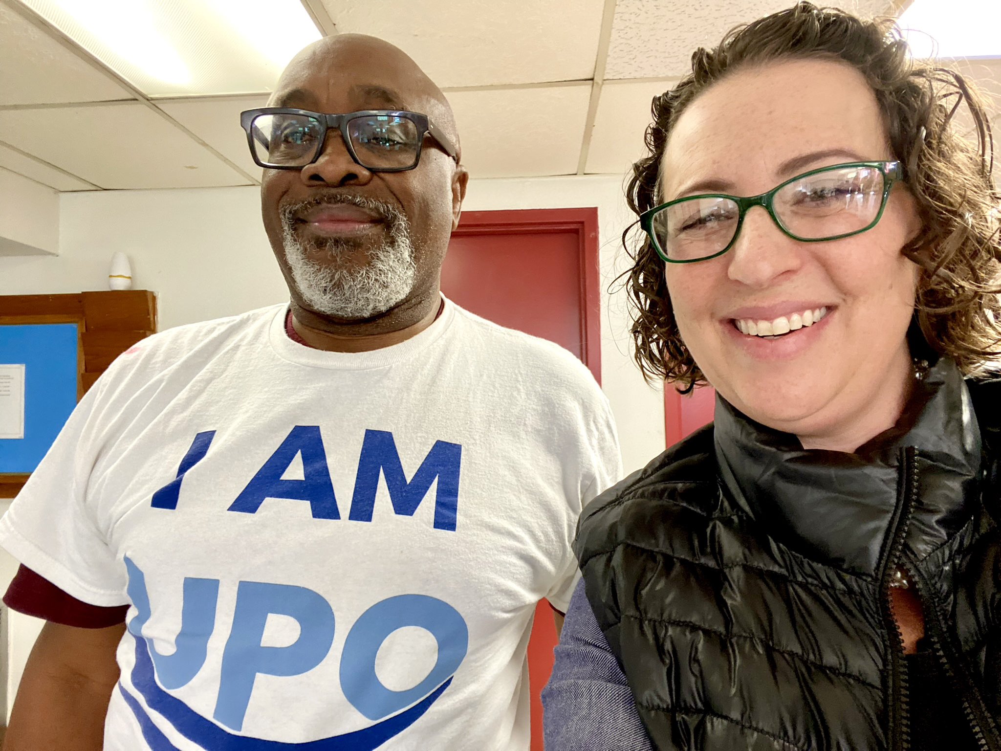 Selfie with a man wearing a "I am UPO" shirt