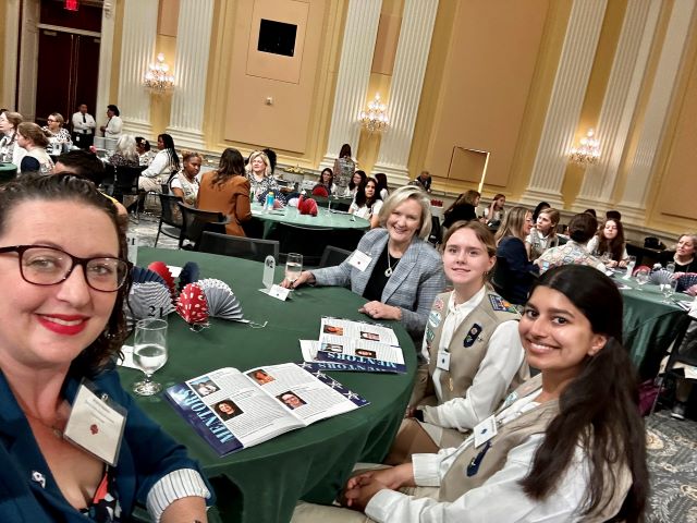 Councilmember Brianne Nadeau poses for a selfie with Girl Scouts and attendees at mentoring luncheon at the US Capitol