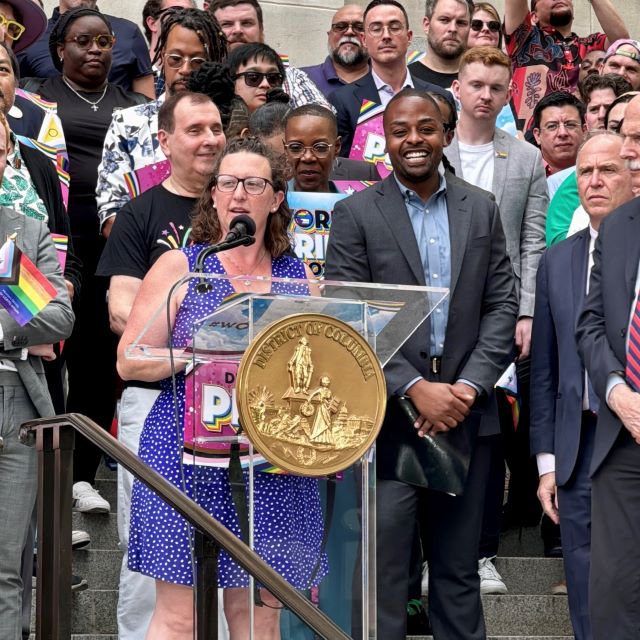 Councilmember Nadeau speaks on the steps of the Wilson Building before the raising of the Pride flag for Pride Month.