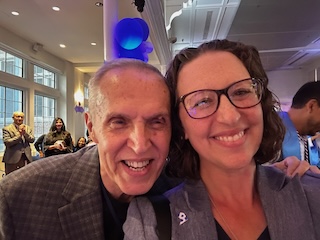 A man and a woman (Councilmember Brianne K Nadeau) pose for a selfie