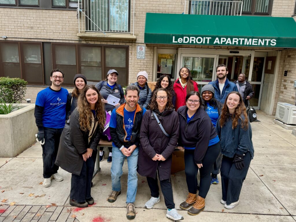Office of Councilmember Brianne Nadeau's team gathers in front of LeDroit apartment building to distribute turkeys