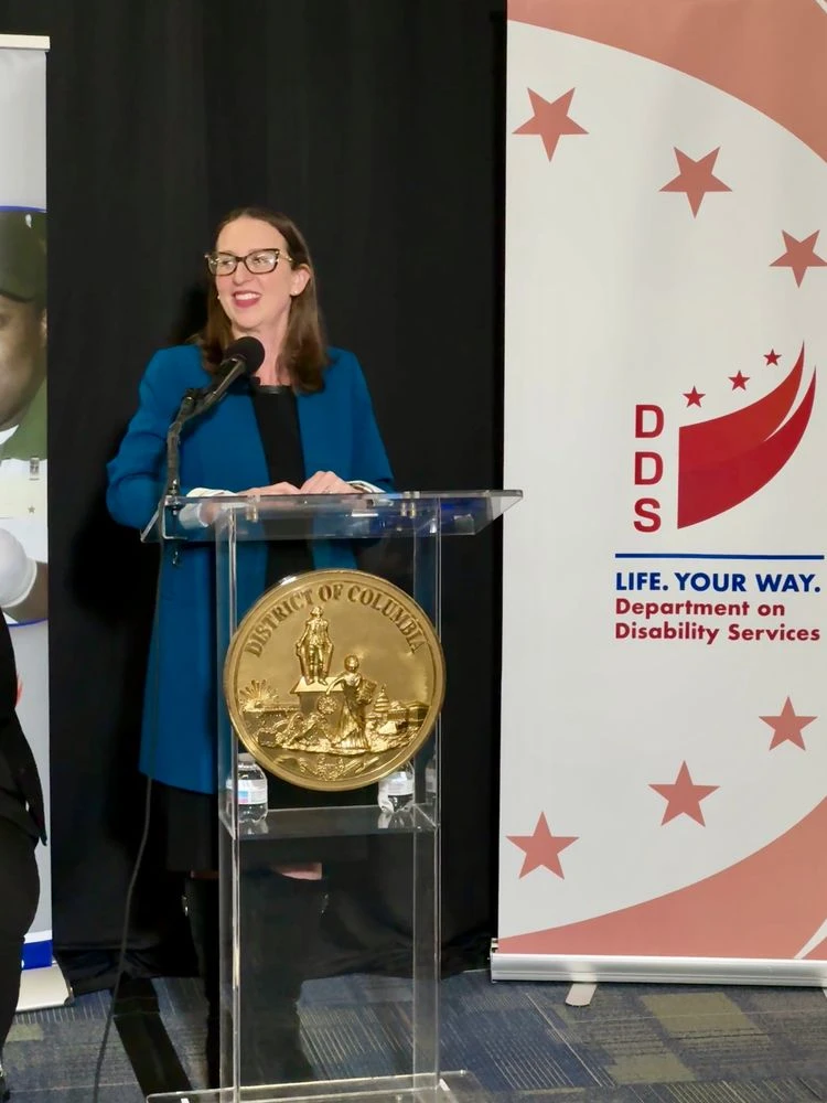 Councilmember Nadeau speaks at the podium.