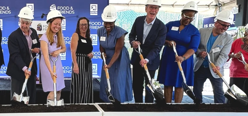 Councilmember Nadeau and others with hardhats and shovels do a ceremonial groundbreaking.