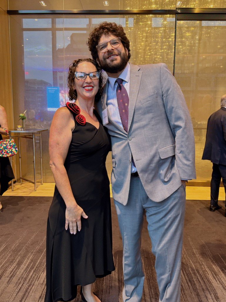 Two people pose for a photo