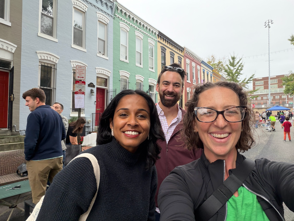 Three people pose for a selfie at the 12th Pl Block Party
