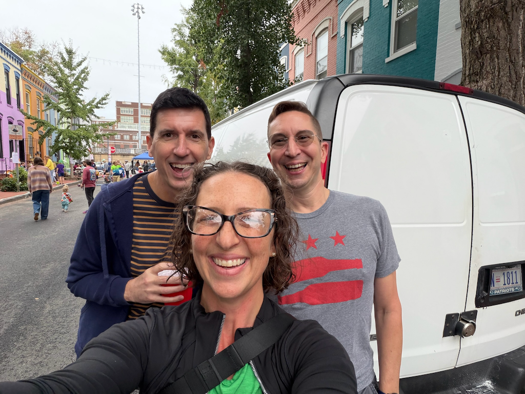 Three people pose for a selfie at the 12th Pl Block Party