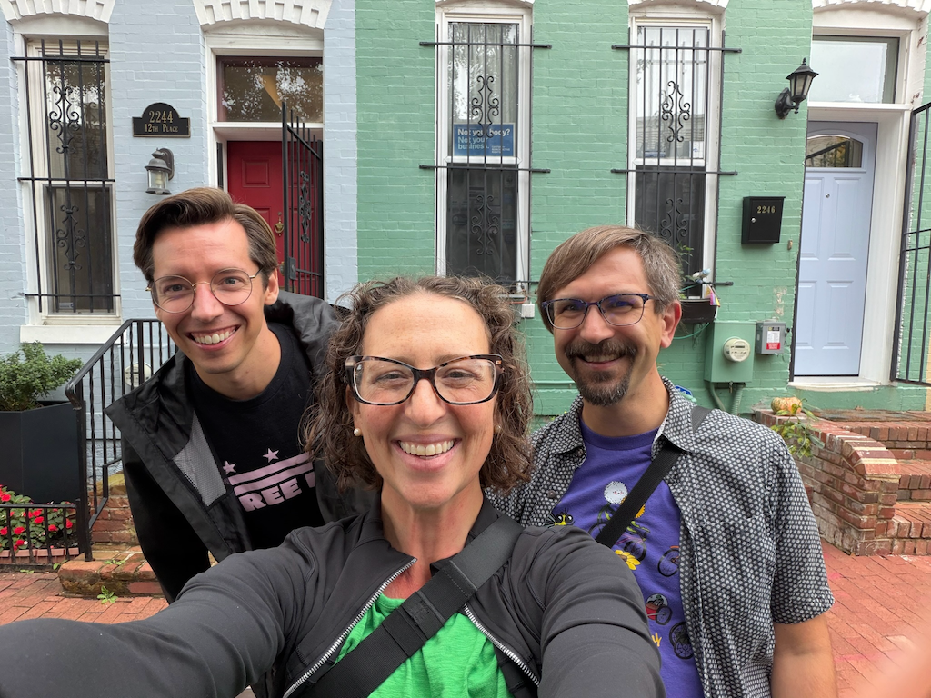 Three people pose for a selfie at the 12th Pl Block Party
